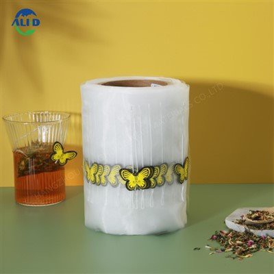 Rotolo di pellicola per sacchetto di imballaggio per bustine di tè a triangolo in rete di nylon piramidale con cordino ed etichetta